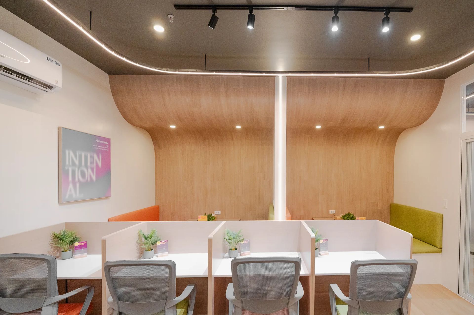 Shared coworking desks and chairs inside Mangoes and Bananas coworking space.