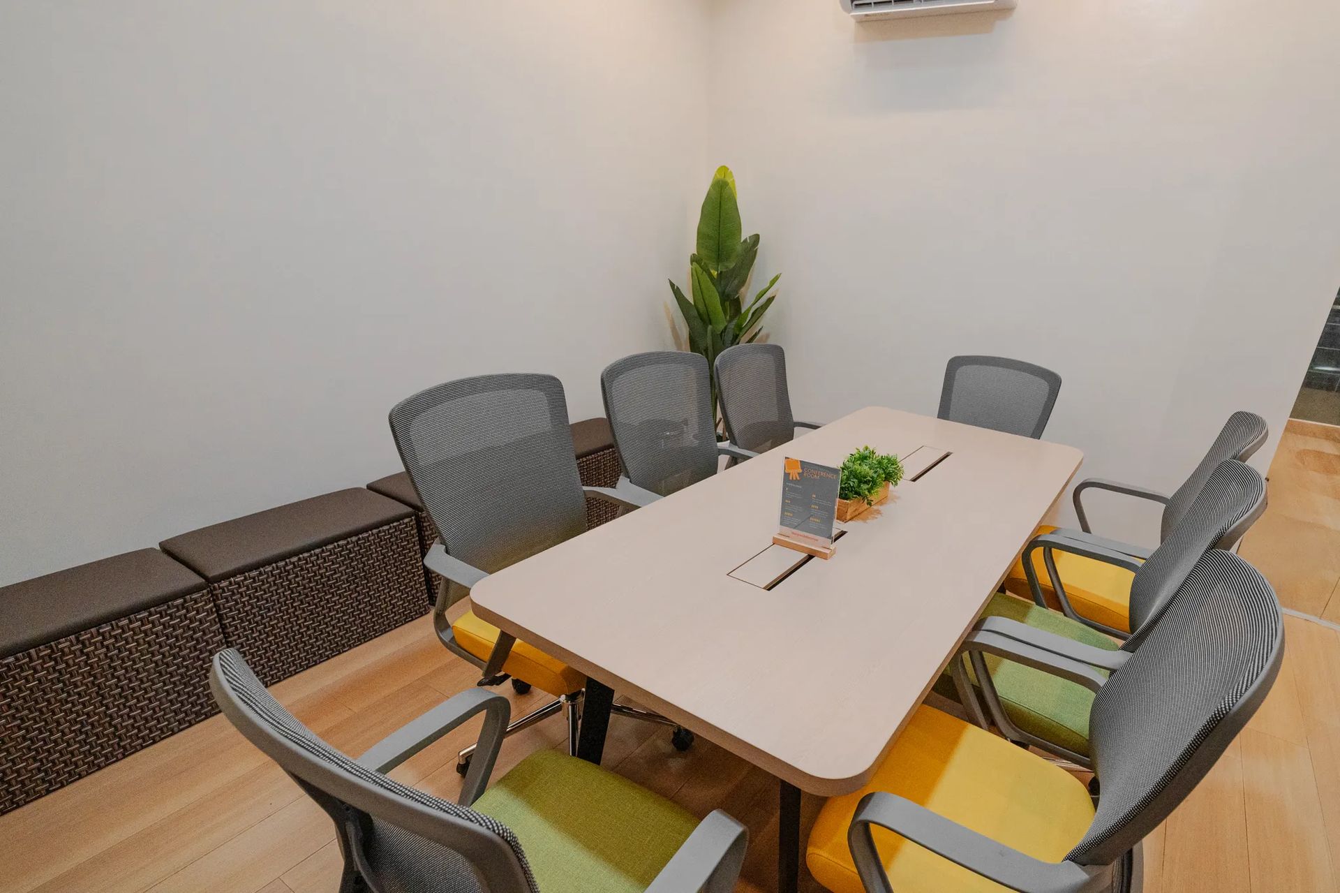 Conference room table and chairs inside Mangoes and Bananas coworking space.